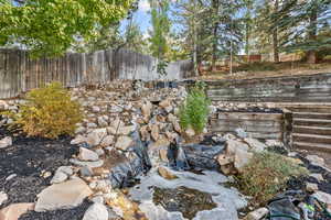 Exterior view of backyard and waterfall feature