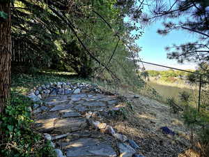 Secluded sitting area at the top tier of backyard with beautiful views