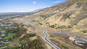 Aerial overview of property's location featuring a mountainous background