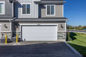 Garage with asphalt driveway