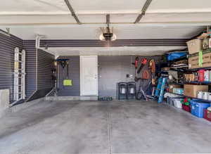 Garage featuring a garage door opener