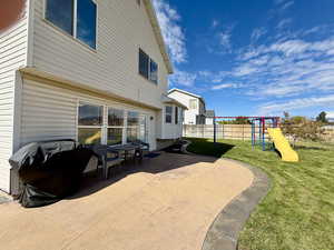 View of patio / terrace with a playground and area for grilling