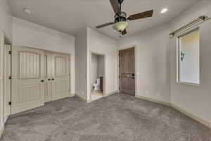 Unfurnished bedroom featuring carpet flooring, a closet, recessed lighting, connected bathroom, and a ceiling fan