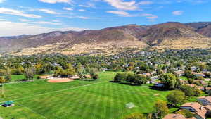 Aerial perspective of suburban area featuring a mountain backdrop