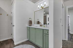 Bathroom with vanity and dark wood-style floors