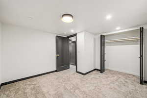 Unfurnished bedroom 4 featuring light colored carpet and recessed lighting