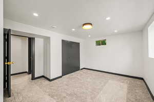 Unfurnished bedroom 4 with recessed lighting, a closet, and carpet floors