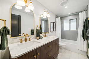 Full bathroom with shower / bath combo with shower curtain, double vanity, light tile patterned flooring, and recessed lighting