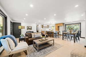 Living room featuring light wood-style flooring and recessed lighting