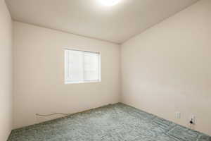 Empty room featuring carpet flooring