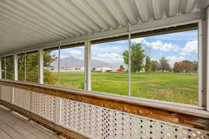 Unfurnished sunroom with a mountain view