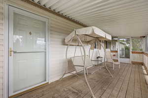 Deck featuring a sunroom