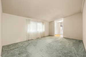 Empty room with carpet flooring