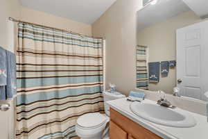 Bathroom featuring vanity and toilet