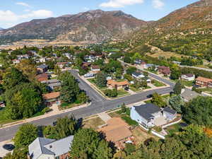 Aerial view of property's location featuring mountains and nearby suburban area