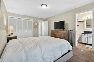 Bedroom with a closet and ensuite bath