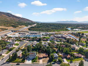Aerial perspective of suburban area with a water and mountain view