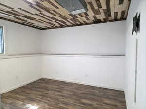 Below grade area featuring dark wood-style floors