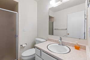 Full bathroom featuring vanity and a stall shower