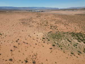 Aerial view of sparsely populated area with a desert landscape and mountains