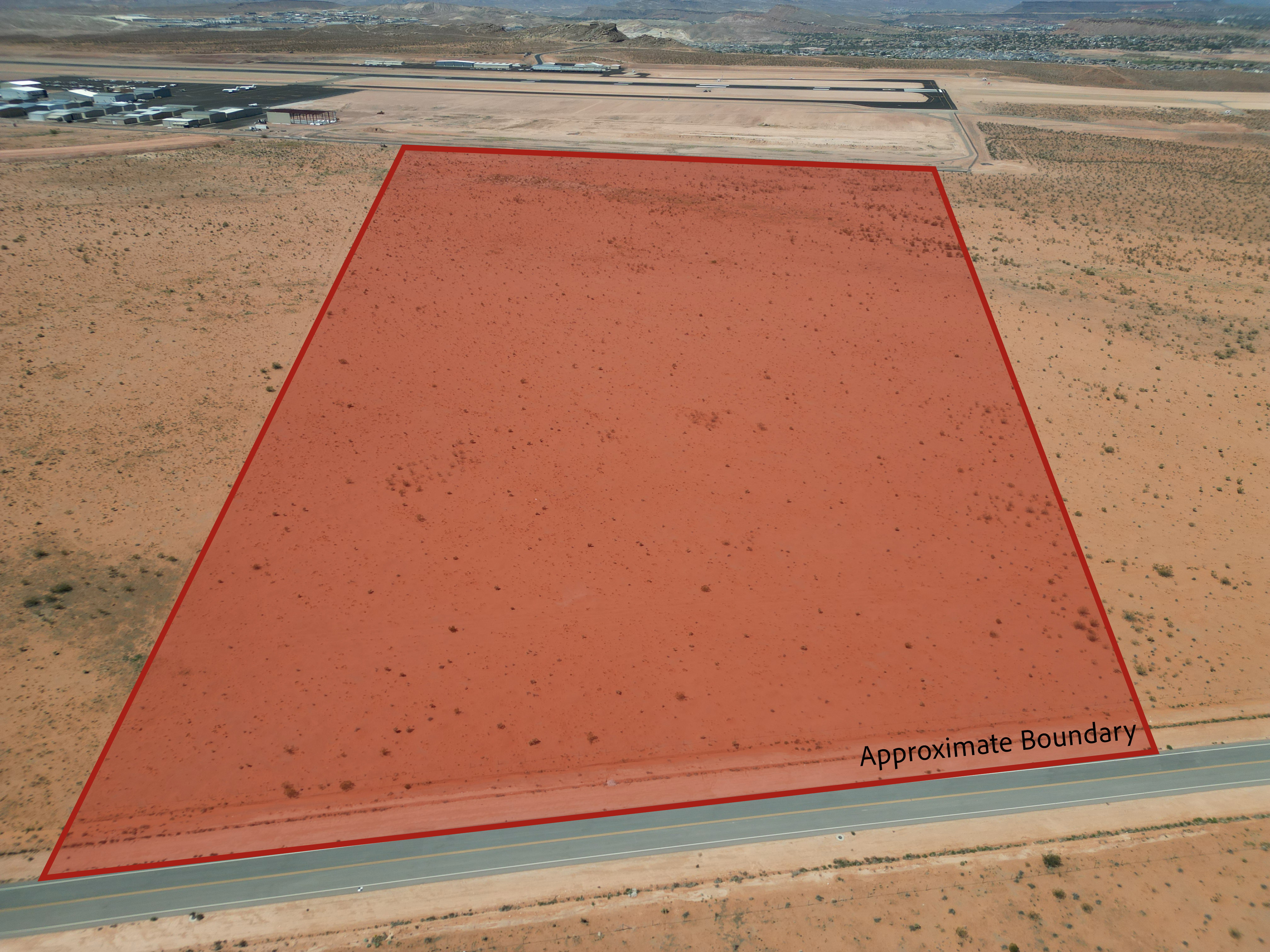 Entry to storm shelter with view of desert landscape and a mountain view