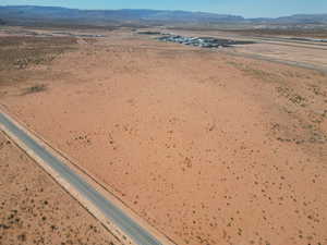 Aerial view of a mountainous background and a desert landscape