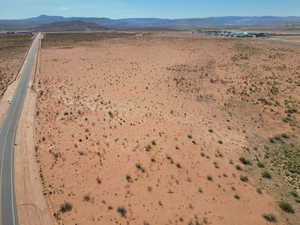 Aerial view of a mountain backdrop and a desert landscape