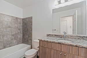 Full bath featuring vanity and tub / shower combination