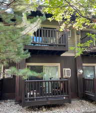 Back of house featuring a balcony