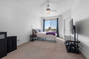 Bedroom with light carpet and ceiling fan