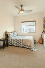 Bedroom featuring carpet floors and ceiling fan
