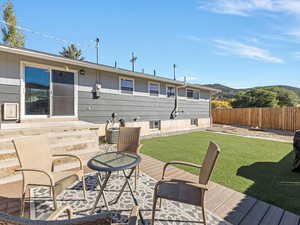 Fenced backyard with a patio and a mountain view