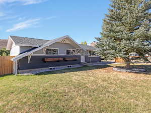 View of front facade featuring roof with shingles and a chimney for fire place