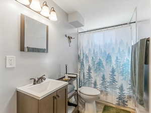 Bathroom featuring shower / bathtub combination and vanity
