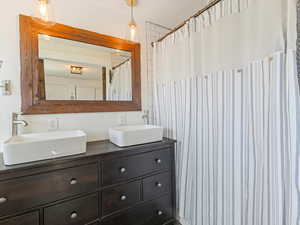 Primary bathroom featuring double vanity