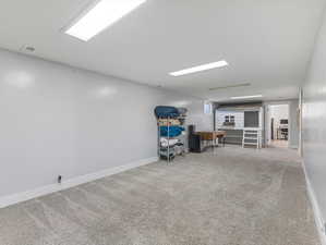 Family room area featuring light carpet