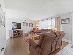 Living area featuring hardwood / wood-style floors