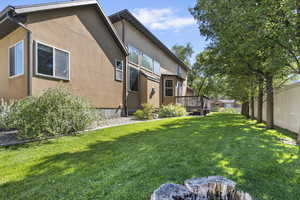View of yard featuring a wooden deck