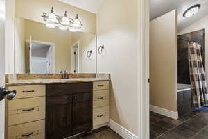 Full bathroom featuring vanity and tiled shower / bath