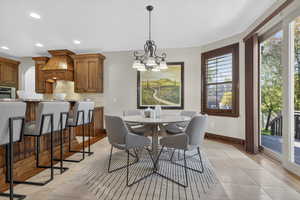 Dining space featuring a chandelier and recessed lighting