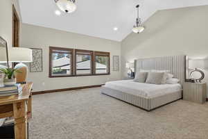 Bedroom with carpet floors, high vaulted ceiling, and recessed lighting