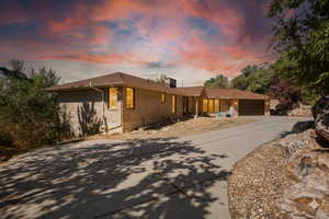 Find me a house tucked in the trees with space to breathe and a sunset backdrop