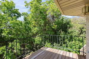 ne of three private decks, surrounded by mature trees and natural views