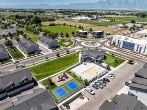 Aerial perspective of suburban area featuring a mountainous background