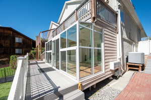 View of home's exterior with a balcony and a deck
