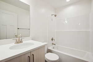 Full bath featuring shower / tub combination and vanity