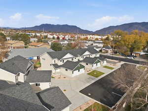 Aerial view of residential area featuring a mountainous background