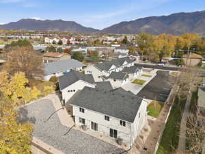 Aerial perspective of suburban area featuring a mountain backdrop
