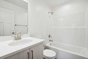 Bathroom featuring bathing tub / shower combination and vanity