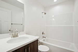 Bathroom featuring bathing tub / shower combination and vanity